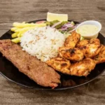 Mixed barbecue chicken and kefta plate at The Matbah near Puerta del Sol